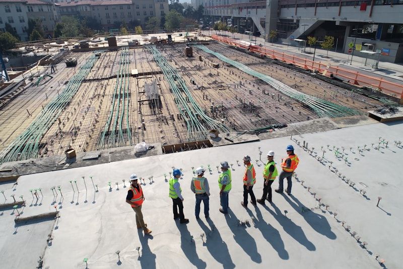 Construction crew in hard hats and high-visibility vests on a job site